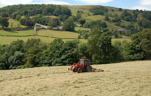 Tractor turning hay Picture Magnets